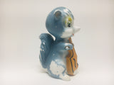1960’s Porcelain Blue Skunk playing a Cello
