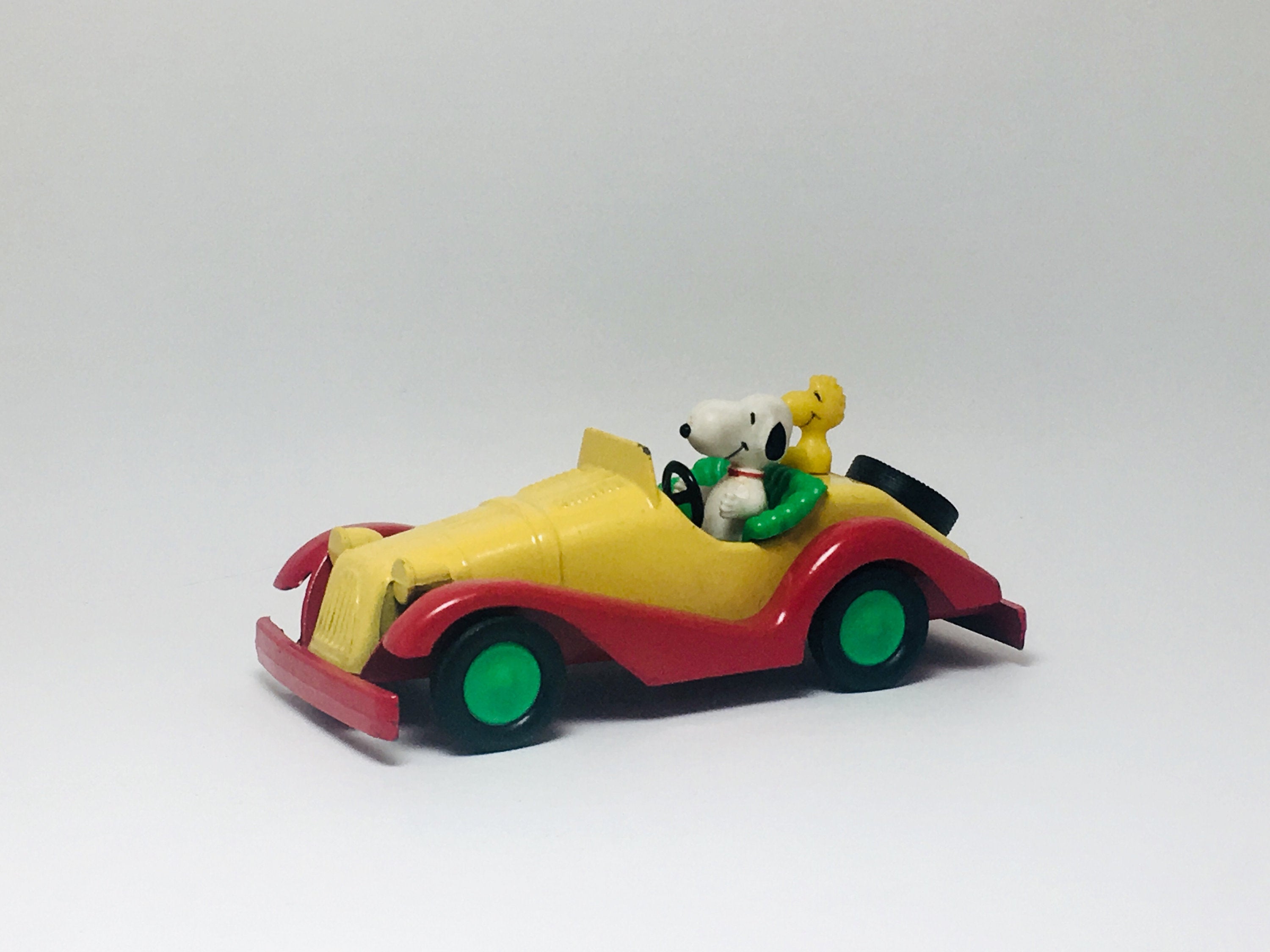 SOLD! 1965 Aviva Toy Co. Snoopy and Woodstock in a race car